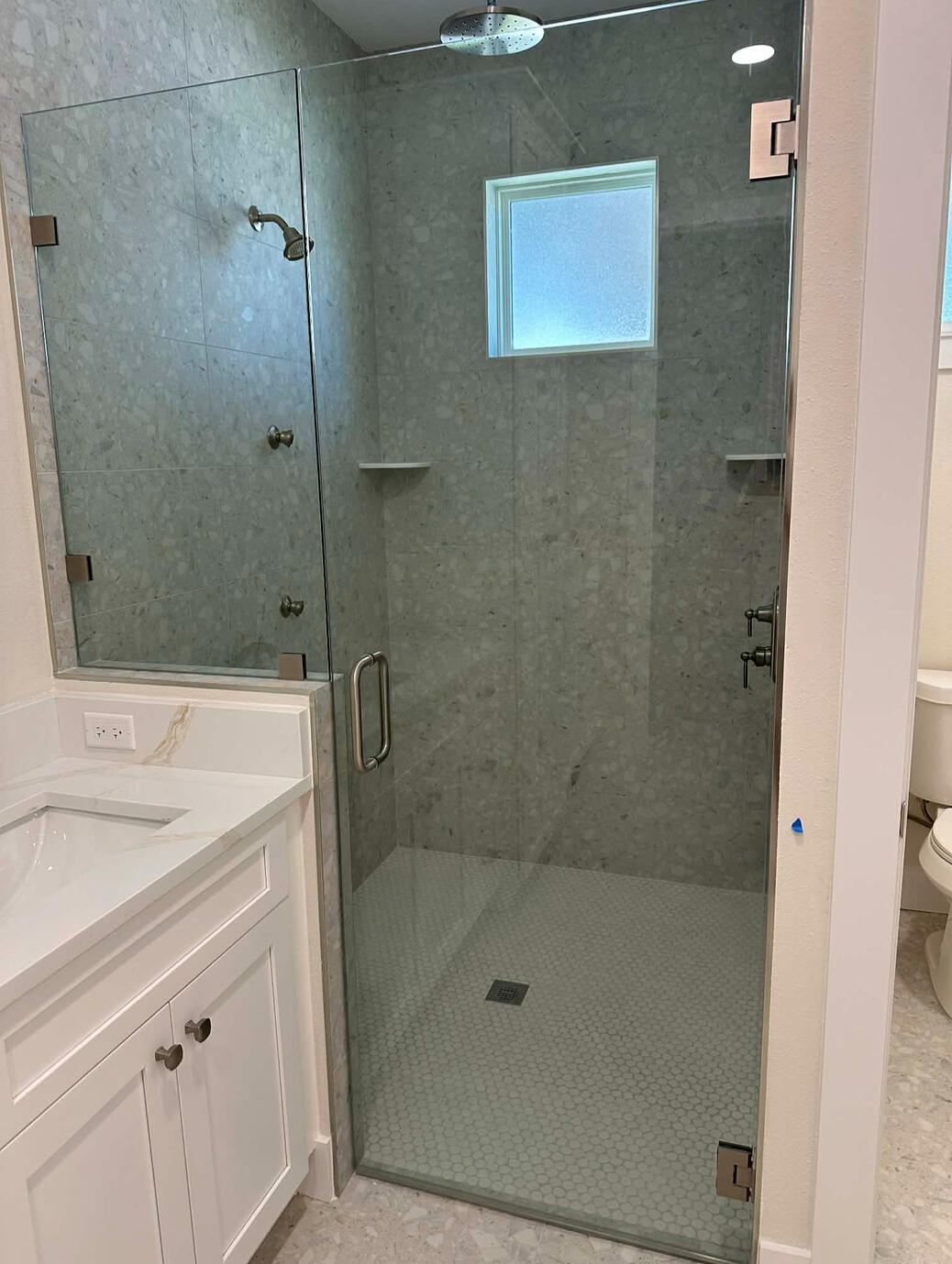 Hexagon Mosaic Shower Tile Floor, Terrazzo Shower Wall Tiles, Terrazzo Floor Tiles, and Marble Shower Shelves