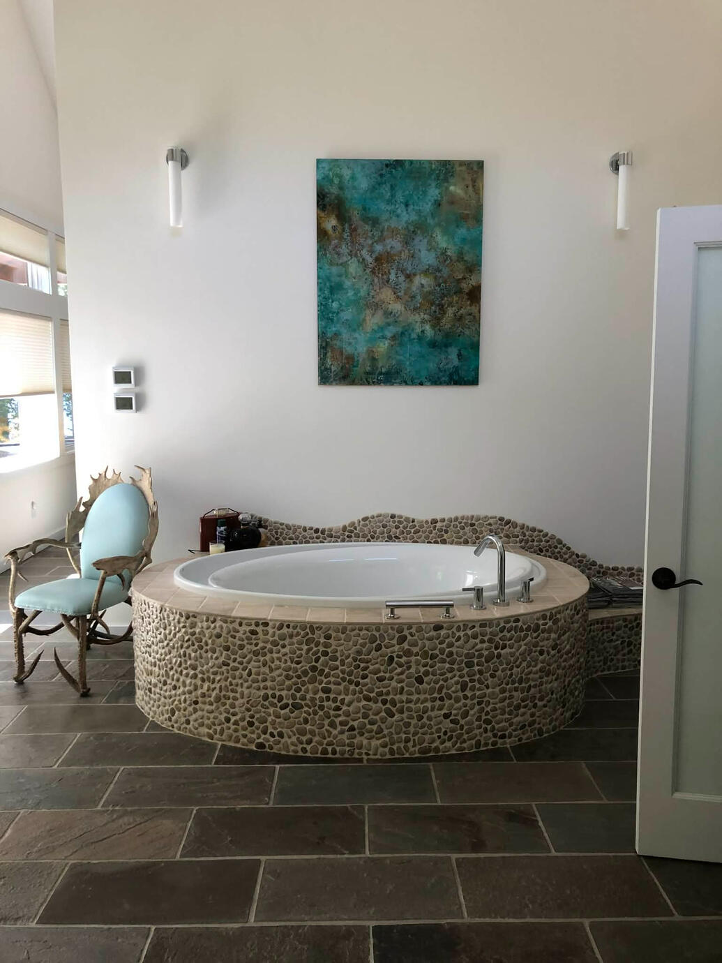Travertine Tile Floor, Custom Built Tub Deck Surrounded by Pebble Stones